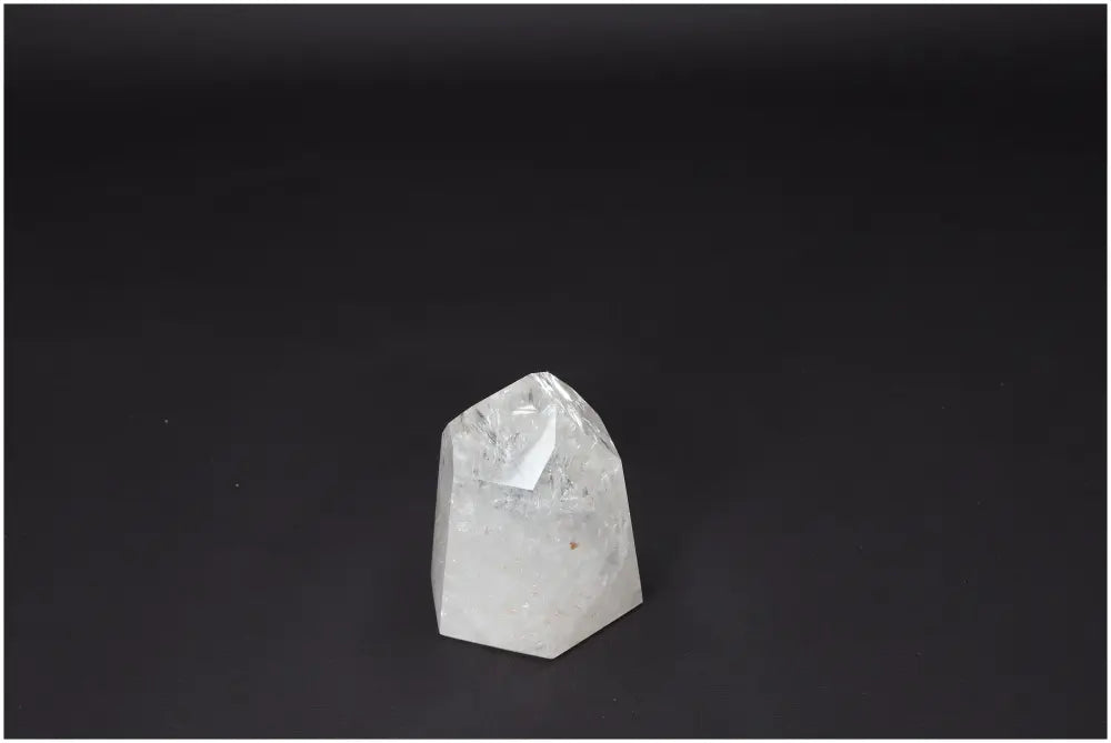 Lemurian Quartz Obelisk on black background, a hand-selected clear quartz crystal for clarity, balance, and personal growth.
