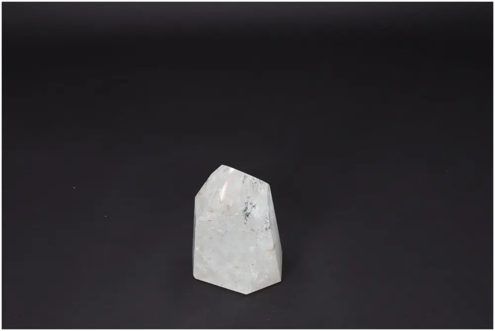 Lemurian Quartz Obelisk on dark background, clear quartz crystal for clarity, balance, and personal growth, known as Master Healer.