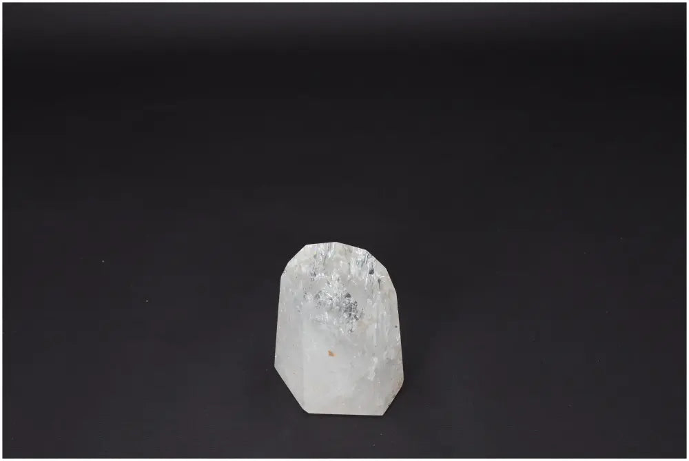 Lemurian Quartz Obelisk on black background, showcasing its natural clarity and powerful energy properties for healing and balance.