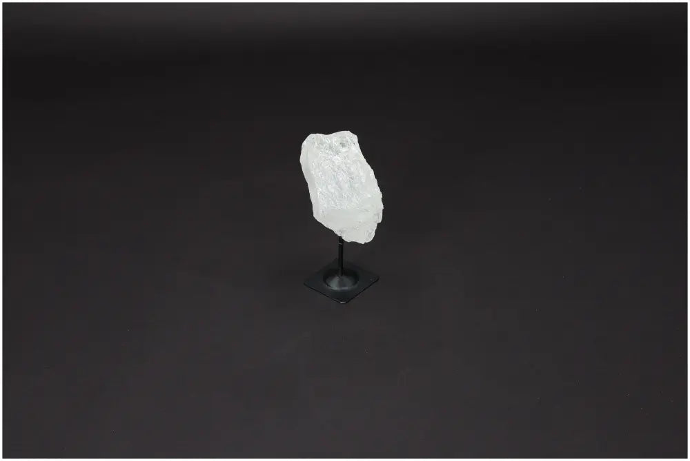 Lemurian Quartz crystal on metal stand for clarity and balance, known as Master Healer, enhances energy and intentions.