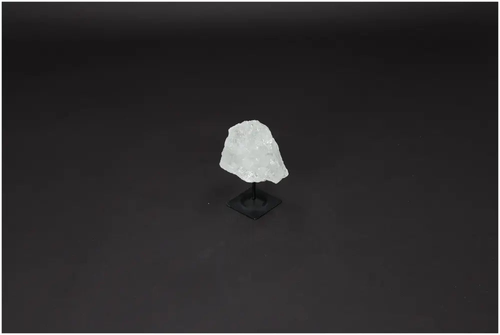 Lemurian Quartz on metal stand, known as "Master Healer," enhancing clarity and balance in a stylish display for personal growth.