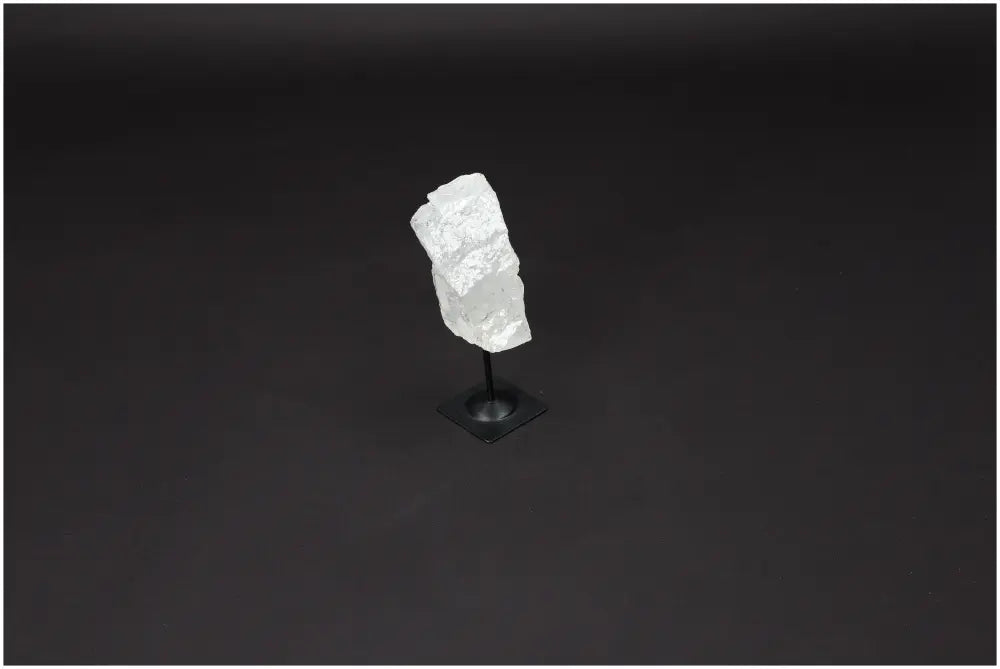 Lemurian Quartz crystal on metal stand, ideal for clarity and energy amplification in personal growth and balance practices.