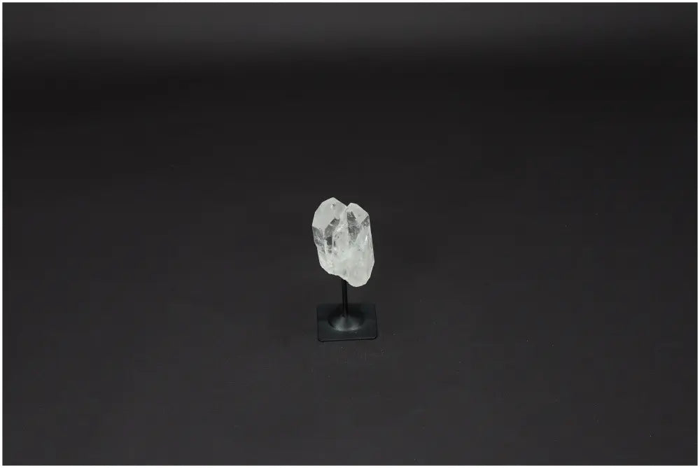 Lemurian Quartz crystal on a metal stand, known as the Master Healer, enhancing clarity, balance, and growth.