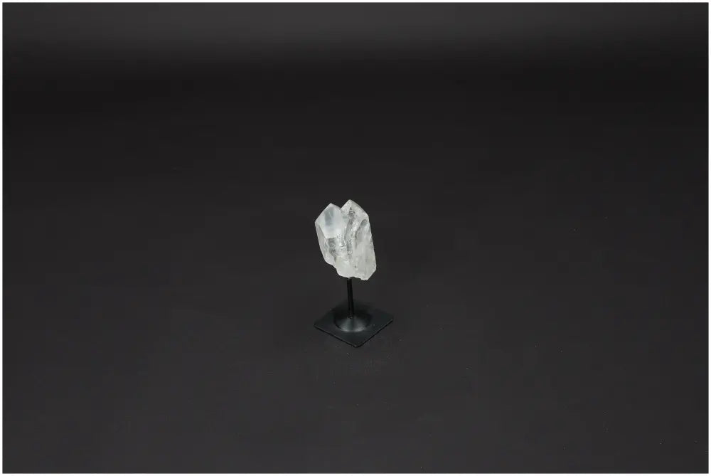 Lemurian Quartz crystal on metal stand, symbolizing clarity, balance, and personal growth, amplifying energy and well-being.