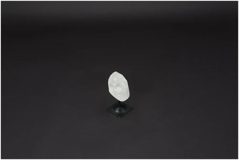 Lemurian Quartz crystal on metal stand, enhancing energy and balance