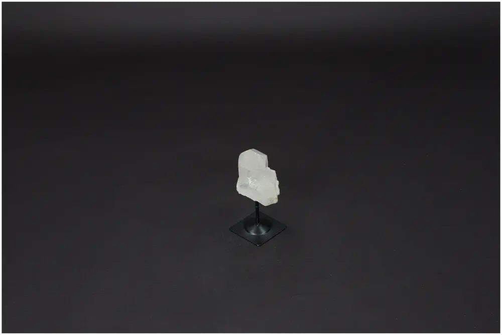 Lemurian Quartz on a black metal stand, showcasing its natural clarity and elegance, perfect for energy amplification and healing.