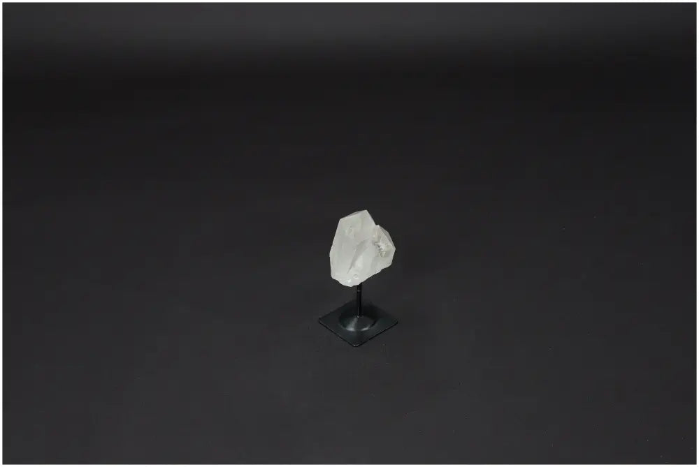 Lemurian Quartz crystal on metal stand for clarity and balance, known as "Master Healer". Ethically sourced and hand-selected.