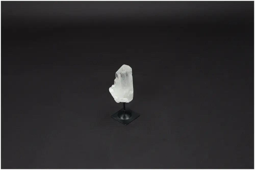 Lemurian Quartz crystal on a metal stand, known as the "Master Healer," amplifying energy and intentions for clarity and balance.