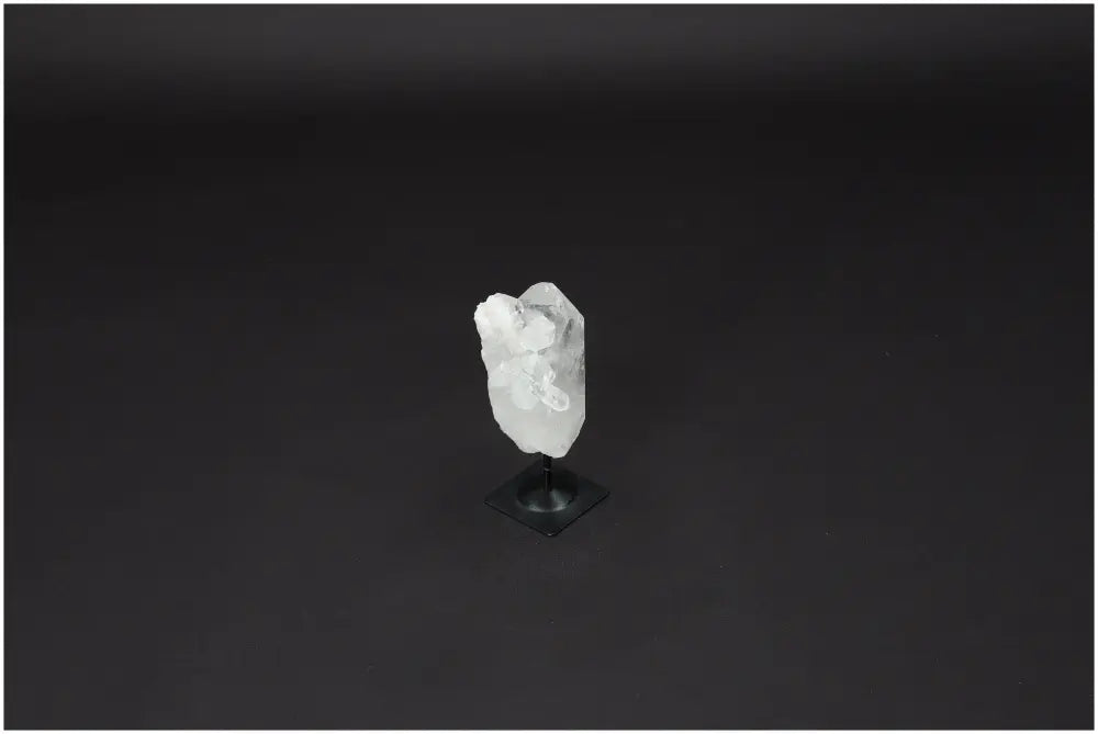 Lemurian Quartz on metal stand, showcasing its clear, naturally formed structure. Known for enhancing clarity and balance. Ethically sourced.