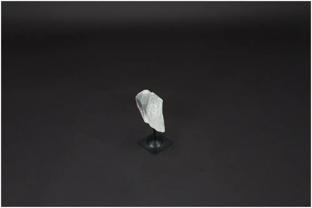 Lemurian Clear Quartz on metal stand, ideal for energy amplification and healing, ethically sourced and naturally formed.