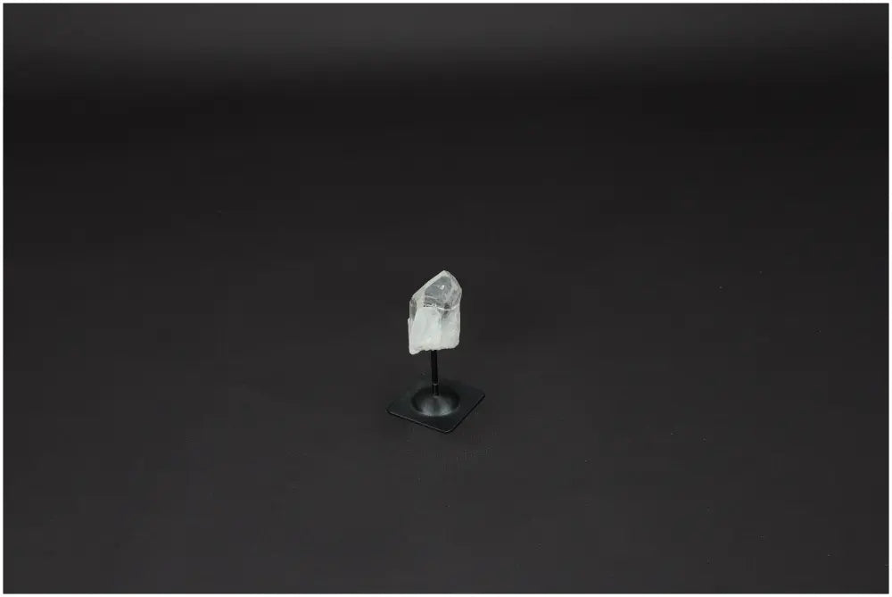 Lemurian Clear Quartz Crystal on Metal Stand for clarity and balance, known as the Master Healer in crystal healing.