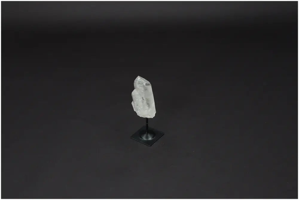 Lemurian Quartz on metal stand, a clear quartz stone for purification and energy harmonization, ideal for neutralizing negative vibrations.