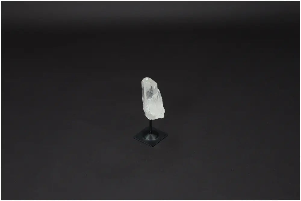 Lemurian Quartz on a sleek metal stand, ideal for purification and harmonizing energy. Perfect for neutralizing negative vibrations.