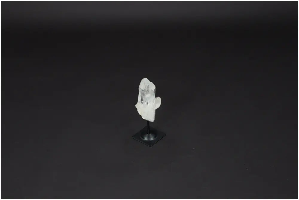 Lemurian Clear Quartz on metal stand for energy purification and harmonizing body and mind, ideal for everyday use.
