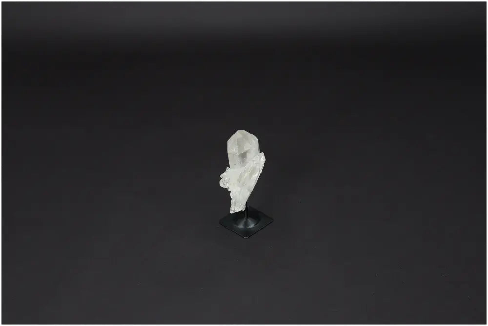 Lemurian Quartz on metal stand, a powerful Clear Quartz crystal known for purification and harmonizing body, mind, and energy.