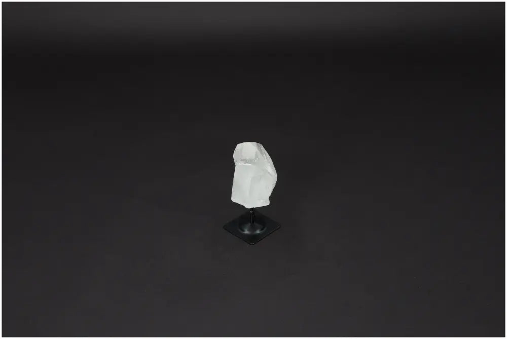 Lemurian Clear Quartz on metal stand for cleansing negative vibes and electromagnetic protection, ideal for personal and spatial harmony.