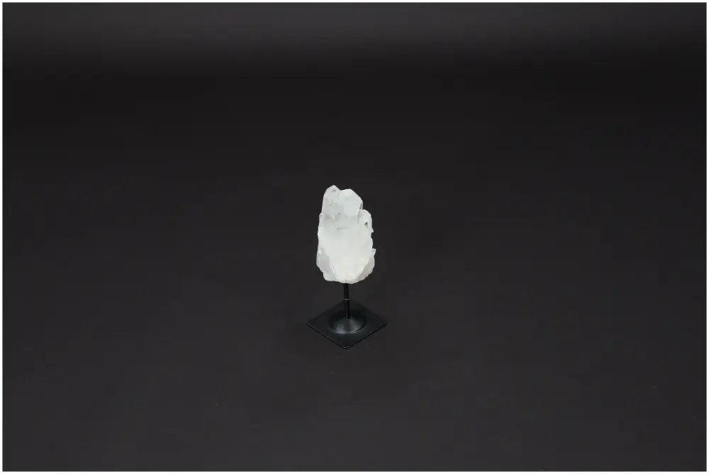 Lemurian Quartz on metal stand showcasing its clear, purifying properties against negative vibrations and harmful electromagnetic radiation