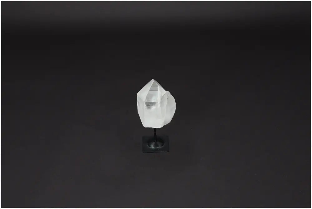 Lemurian Quartz crystal on metal stand against a dark background, ideal for purification, harmonizing energy, and absorbing negative vibrations.