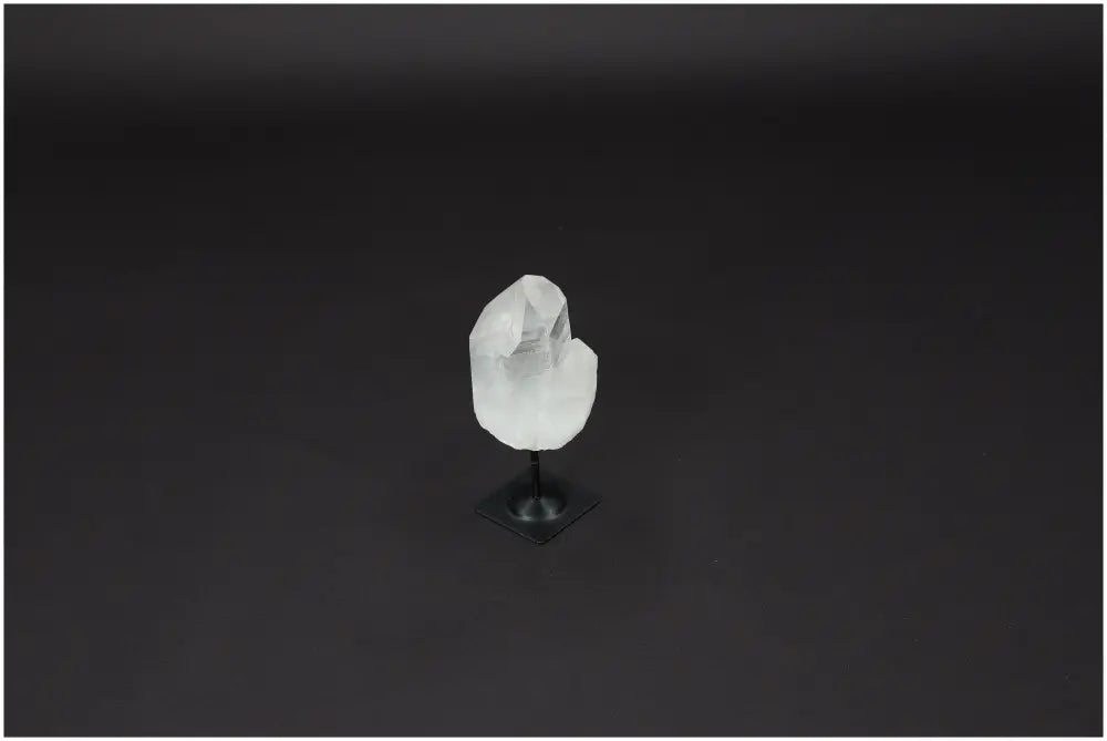 Lemurian Quartz crystal on metal stand, known for its powerful purification and negative vibration neutralization properties.