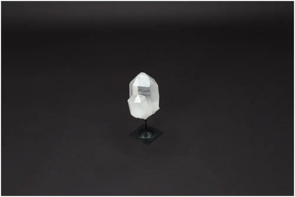 Lemurian Clear Quartz on metal stand for energy purification and space cleansing, absorbing negative vibrations and harmful radiation.