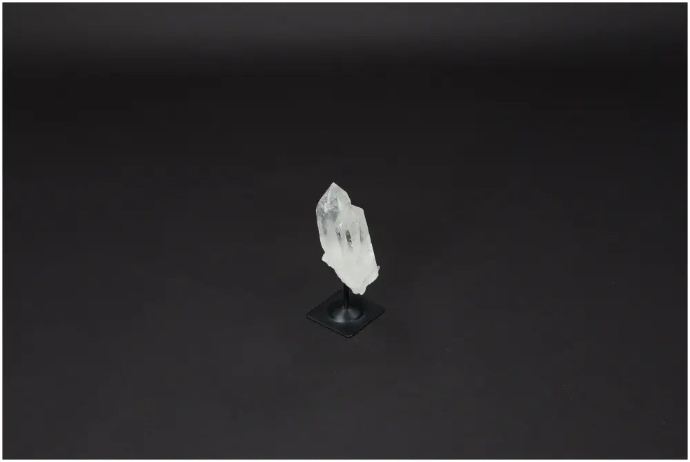 Lemurian Quartz on metal stand, clear crystal for purification and neutralizing negative vibrations, ideal for harmonizing energy.