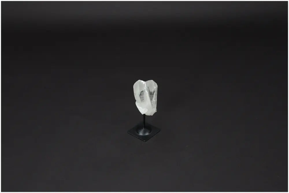 Lemurian Quartz crystal on a sleek metal stand, ideal for harmonizing energy and neutralizing negative vibrations in any space.