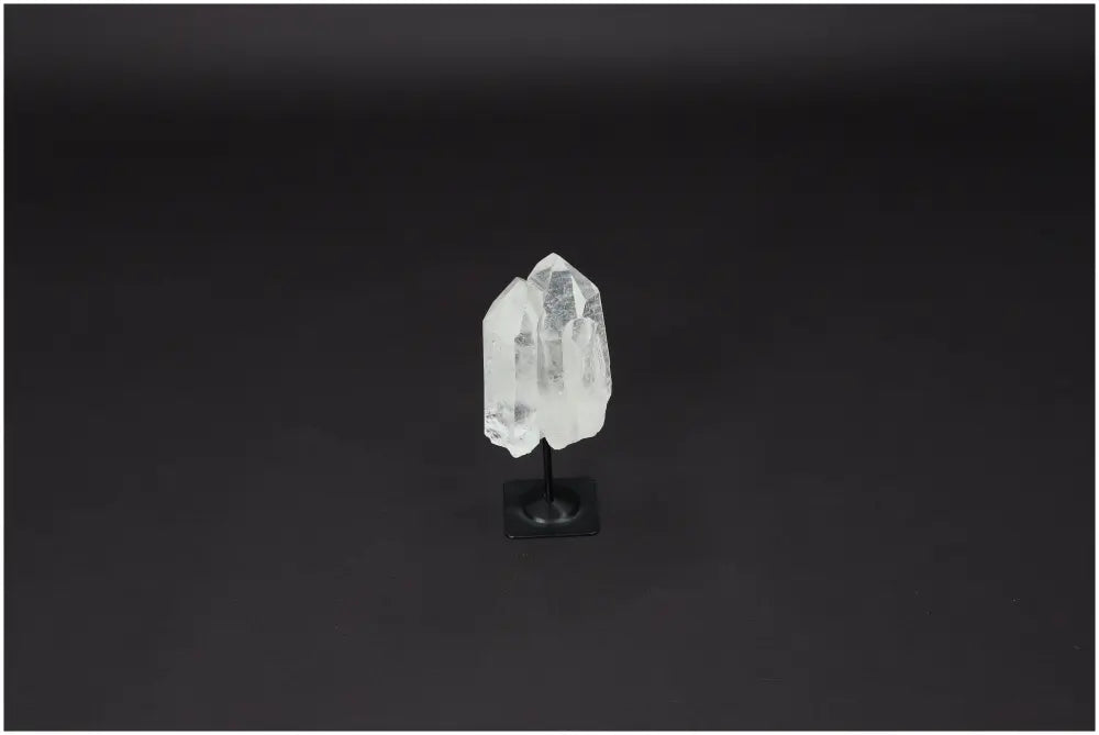 Lemurian Quartz on black metal stand for purification, absorbing negative energy, and cleansing spaces from harmful radiation.