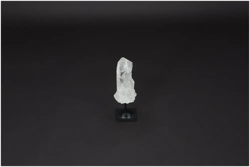 Lemurian Quartz gemstone on a black metal stand, ideal for harmonizing energy and neutralizing negative vibrations.