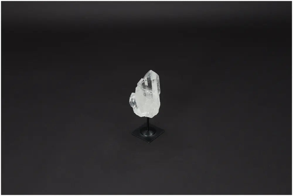 Lemurian Quartz on metal stand, clear crystal for purification and harmonizing energy, ideal for absorbing negative vibrations.