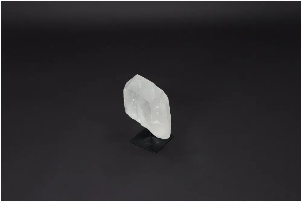 Lemurian Quartz crystal on a metal stand, showcasing its clear, purifying properties and elegant display.
