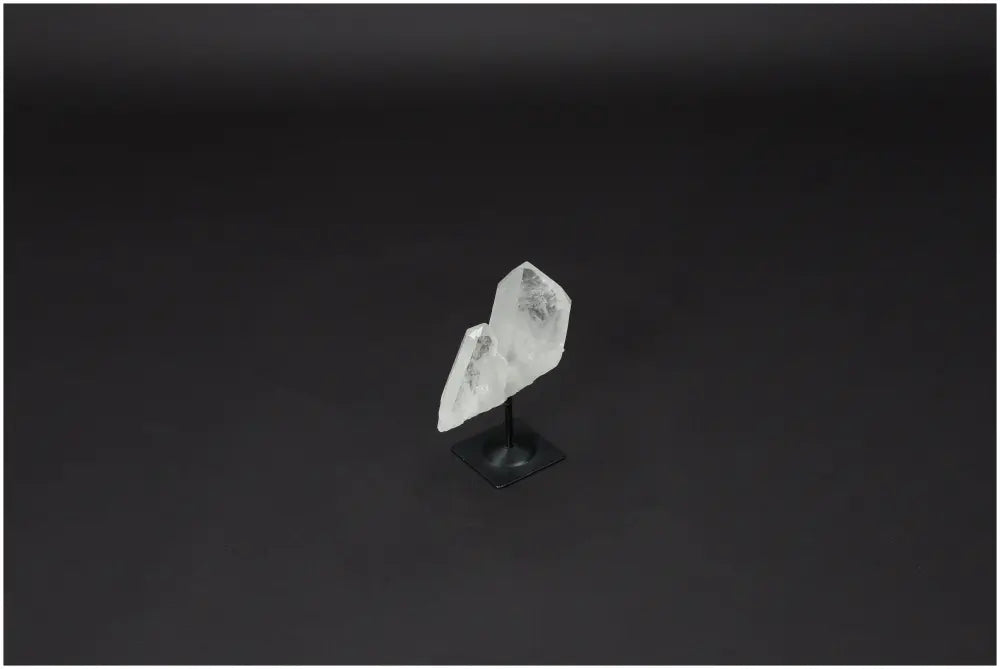 Lemurian Quartz on metal stand showcasing its clear crystal structure for energy purification and harmonization.