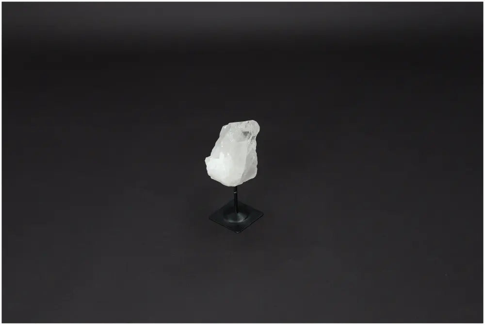 Lemurian Quartz Crystal on Metal Stand with Black Background, Ideal for Purifying Energy and Neutralizing Negative Vibrations