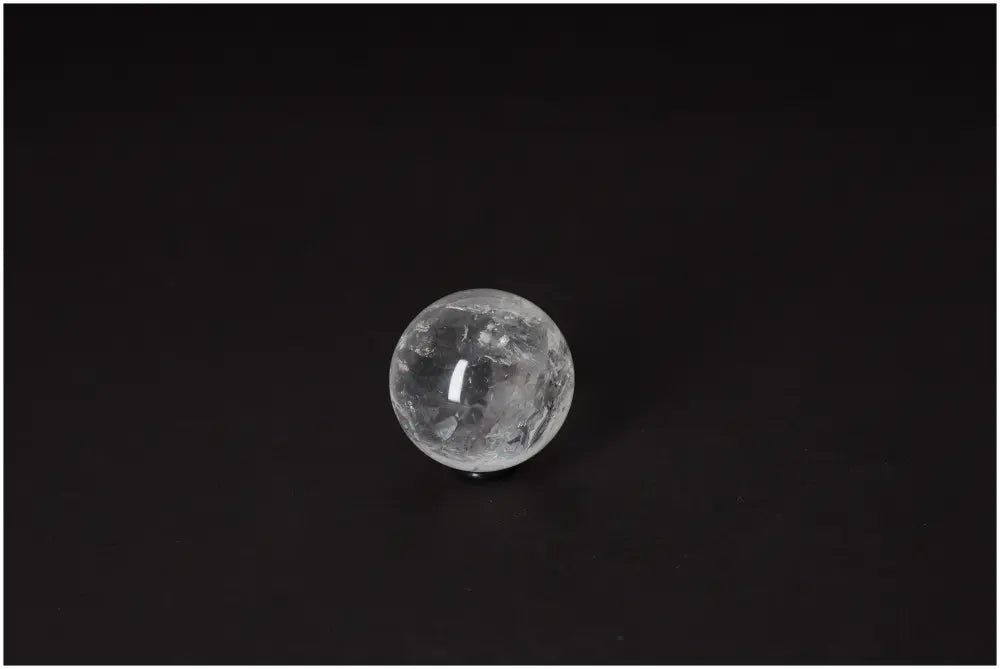 Lemurian Quartz Sphere 4-5 CM on black background, known for radiant energy, spiritual growth, and intuitive properties.