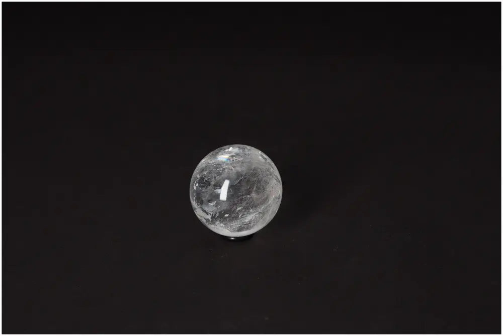Lemurian Quartz sphere, 4-5 cm, showcasing radiant energy and ancient wisdom against a dark background.