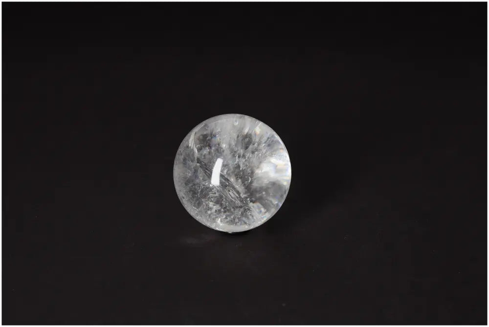Lemurian Quartz Sphere 5-6 CM on dark background, noted for its radiant clarity and spiritual energy, ideal for intuition and inner clarity.