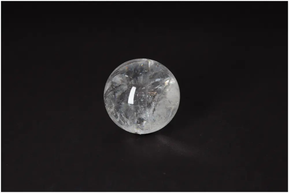 Lemurian Quartz Sphere 6-7 CM on black background, showcasing luminous clarity and ancient energy.