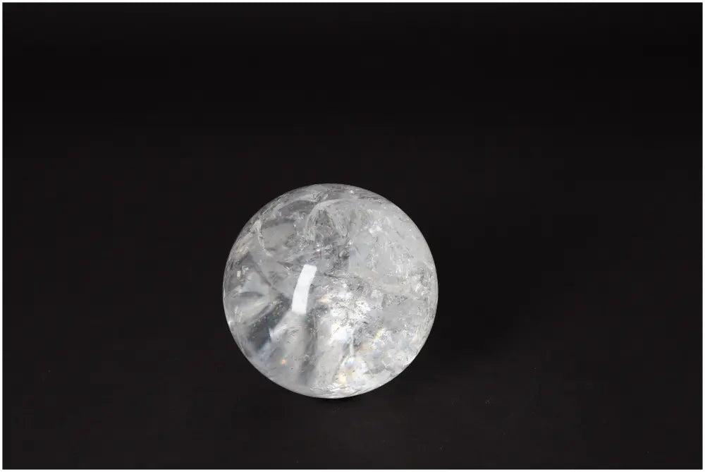Lemurian Quartz Sphere 7-8 CM showcasing radiant energy and clarity on a black background.