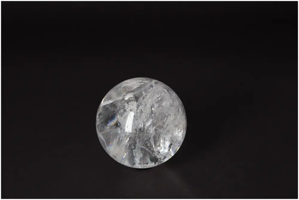 Lemurian Quartz Sphere 7-8 CM on black background, showcasing its luminous clarity and spiritual energy.