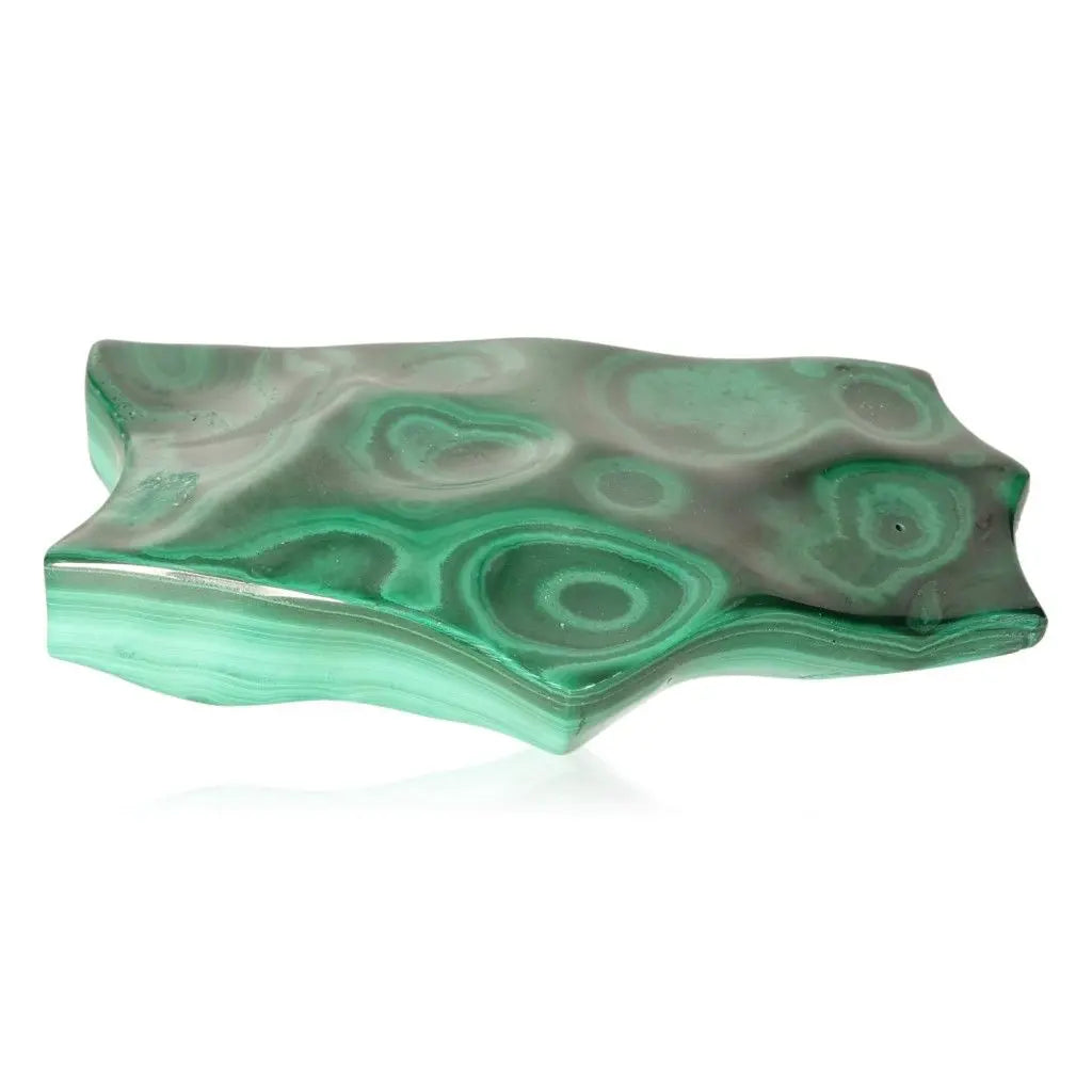 Polished green malachite stone with swirling patterns, symbolizing transformation and soothing energy, known as the 'stone of nature'.