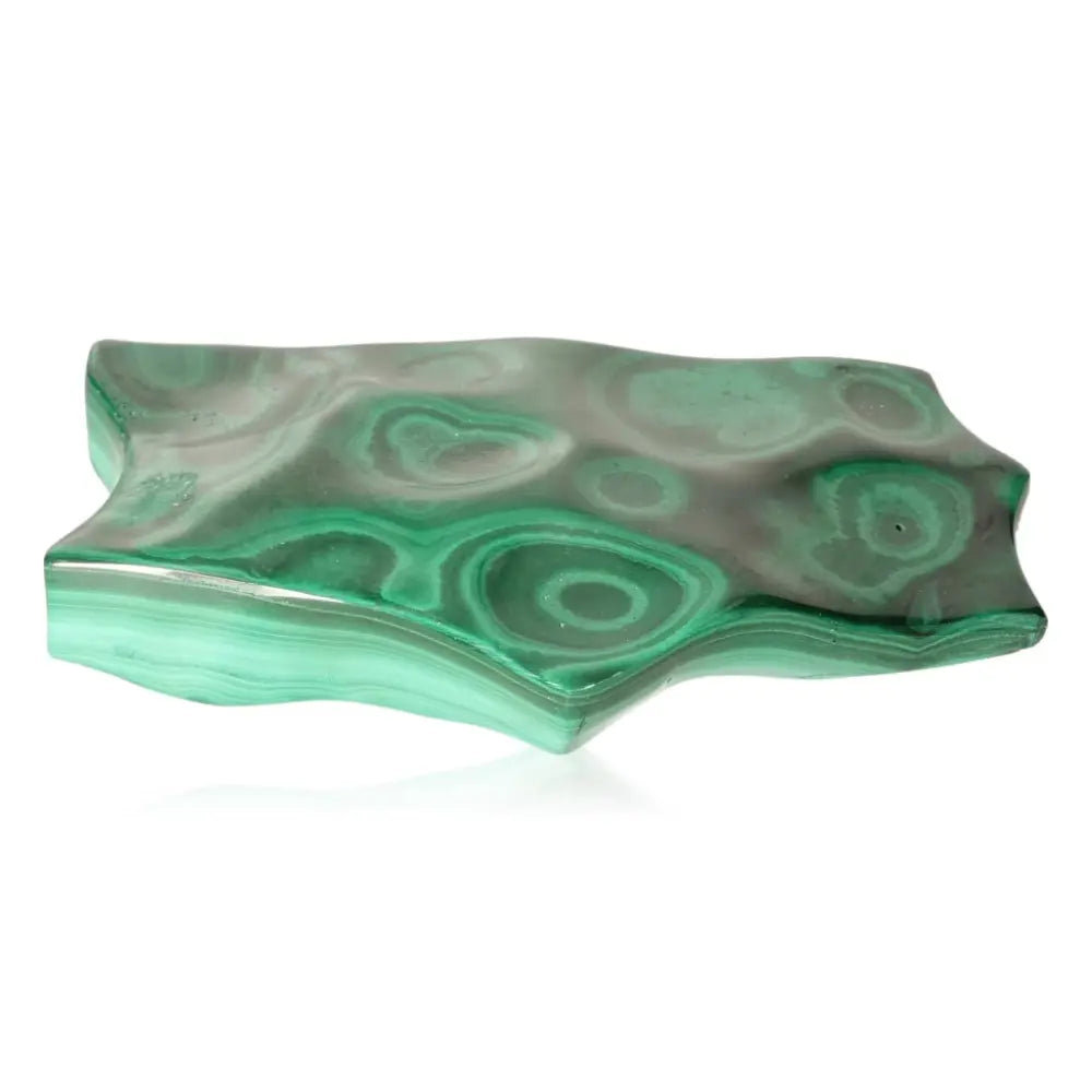 Malachite stone with swirling green patterns, embodying transformation and soothing energy