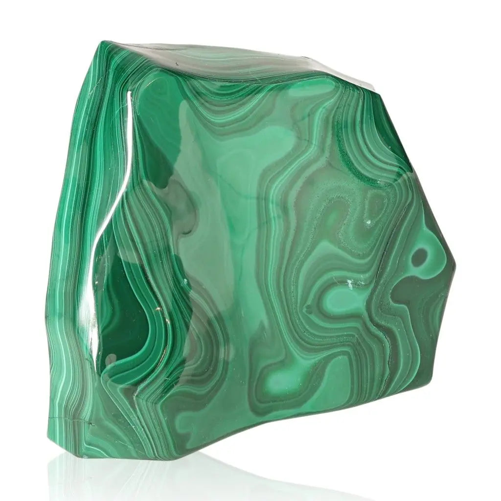 Vibrant green Malachite gemstone with swirling patterns, showcasing aesthetic beauty and soothing healing properties.