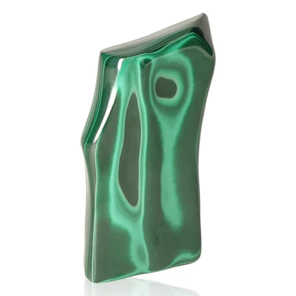 Polished Malachite gemstone reflecting vibrant green patterns symbolizing nature's tranquility, energy, and balance.