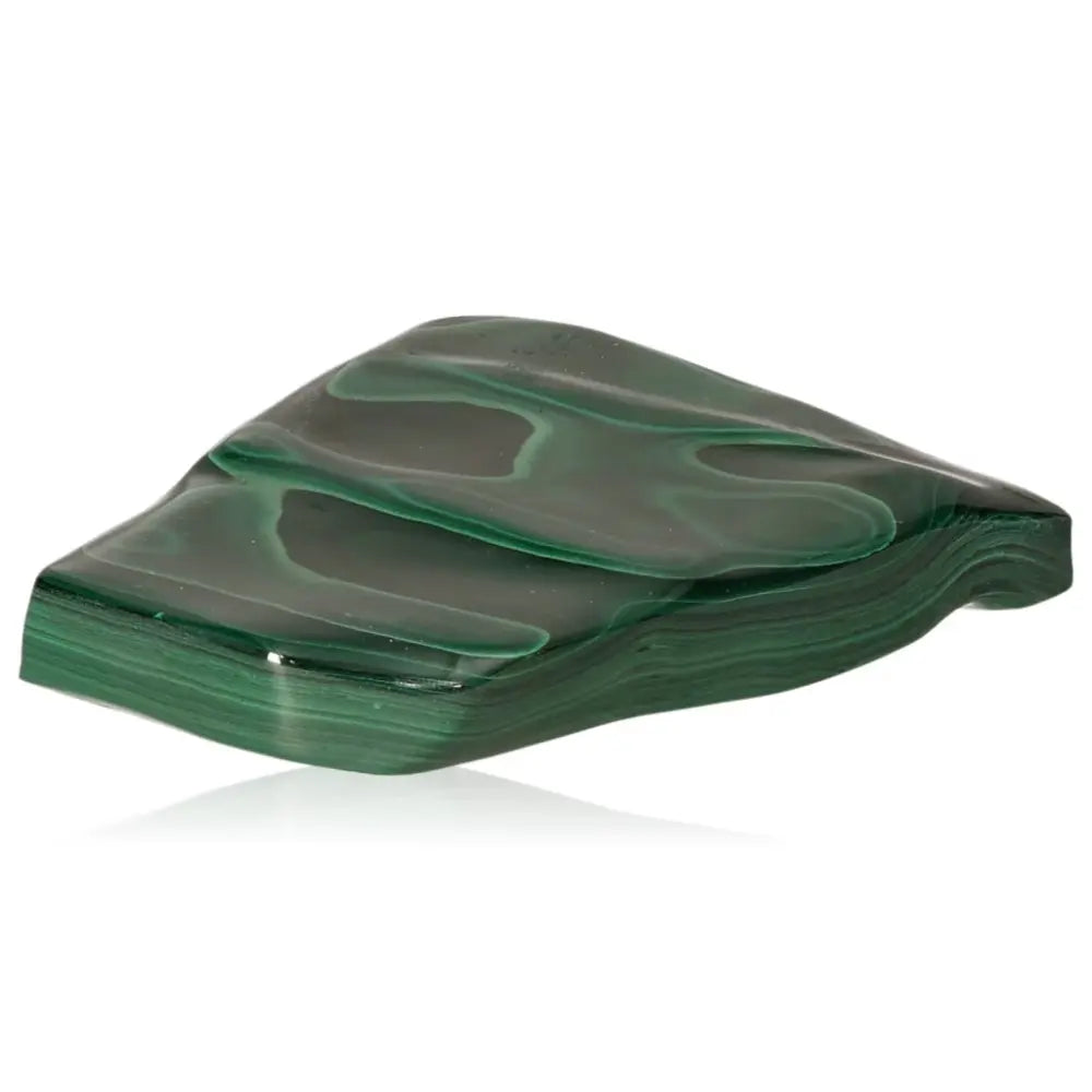 Polished green malachite gemstone showcasing nature's soothing energy and transformative power.
