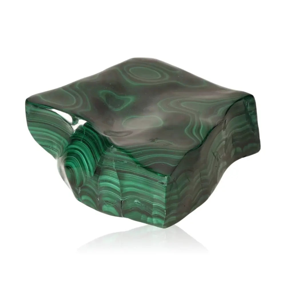 Lush green Malachite stone featuring swirling patterns, symbolizing natural beauty and providing calming energy.