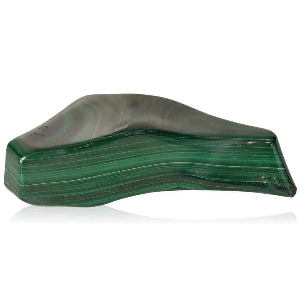 Malachite gemstone featuring lush green swirls, symbolizing nature's serenity and offering soothing energy and courage.