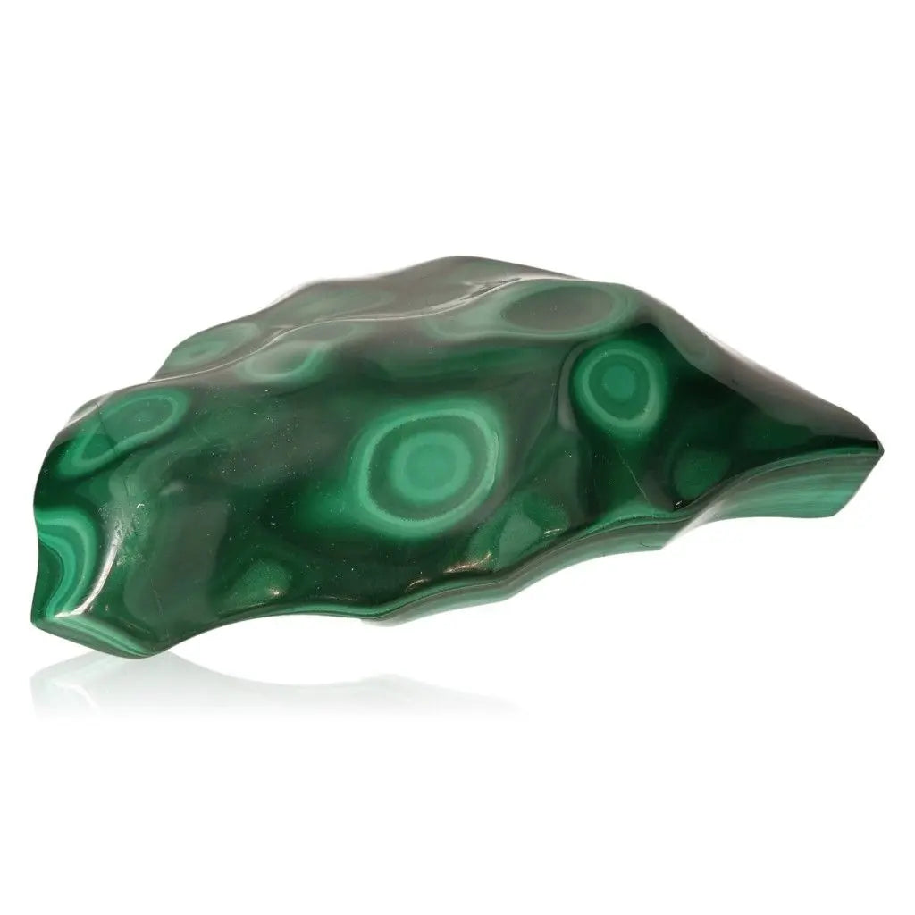 Beautiful polished green malachite stone with distinctive swirling patterns, symbolizing tranquility and positive energy.