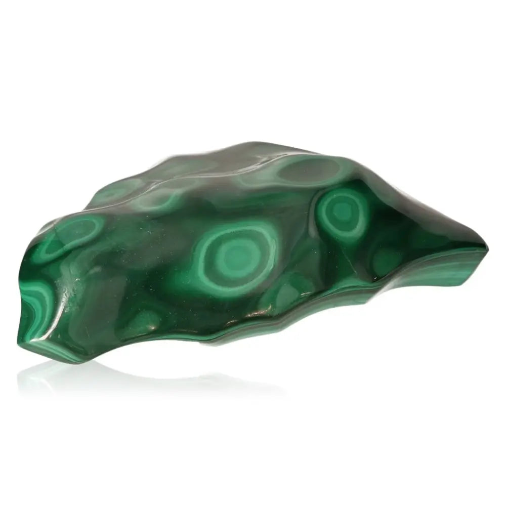 Malachite stone with vibrant green patterns, exuding tranquil energy and encouraging an open heart.