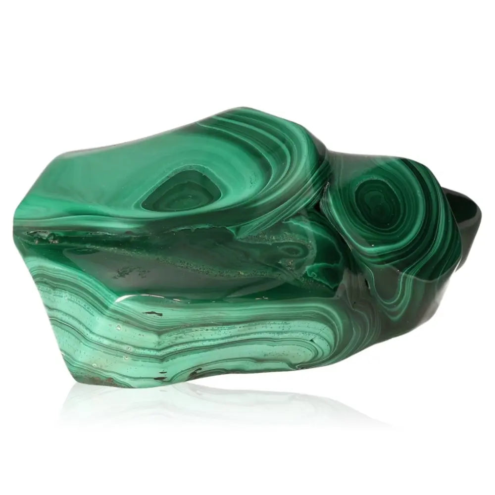 Polished malachite gemstone with rich green hues symbolizing balance, growth, and renewal