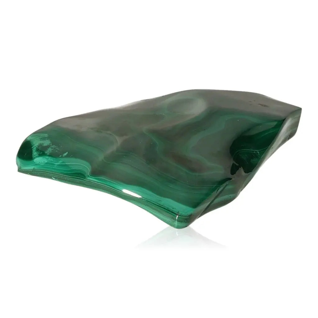 Polished malachite stone showcasing vibrant green patterns, embodying nature's transformative energy and soothing essence.
