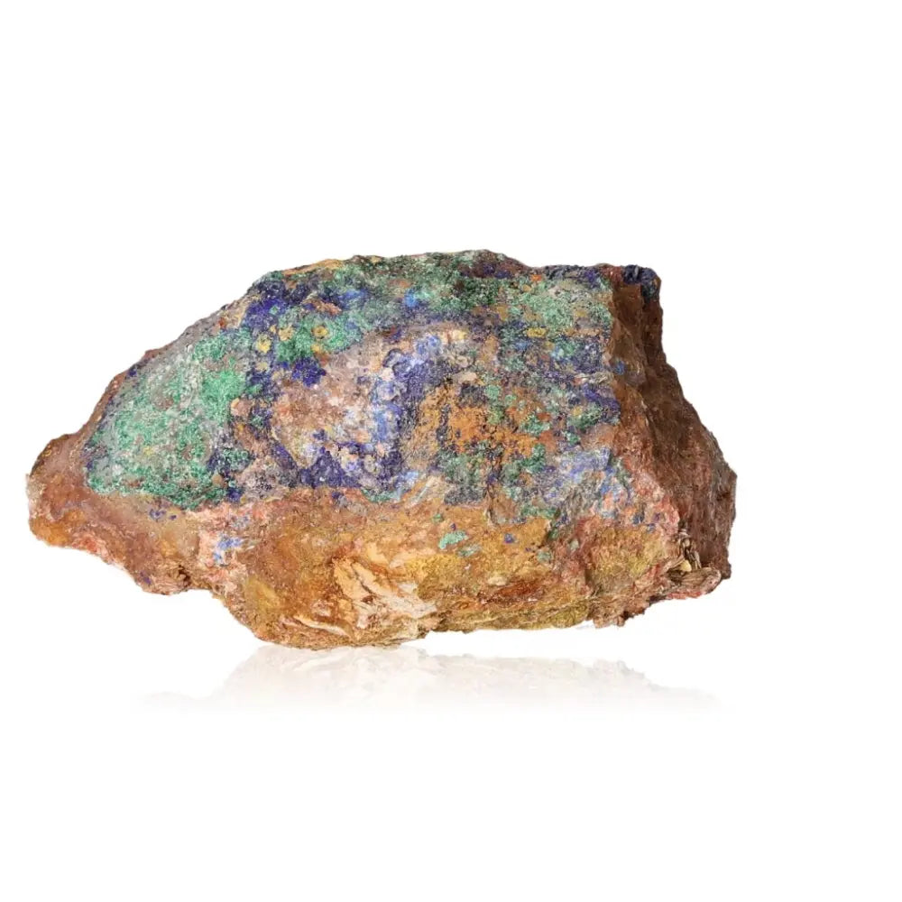 Raw Malachite stone with vibrant green and blue swirls on a reflective surface.